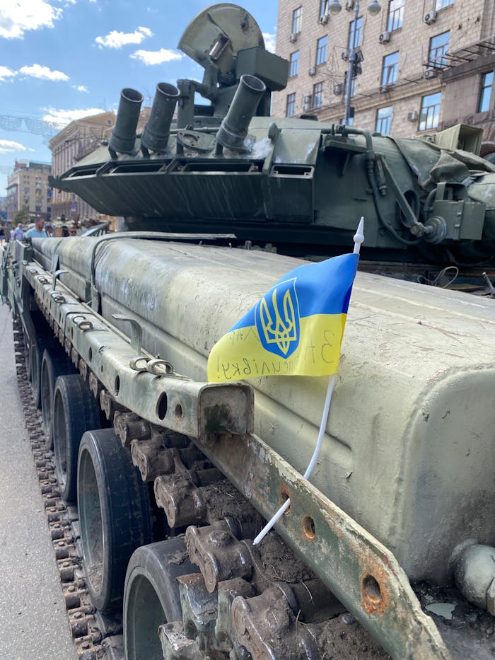 A Ukrainian flag adorns a military tank on a street in Kyiv, Ukraine.