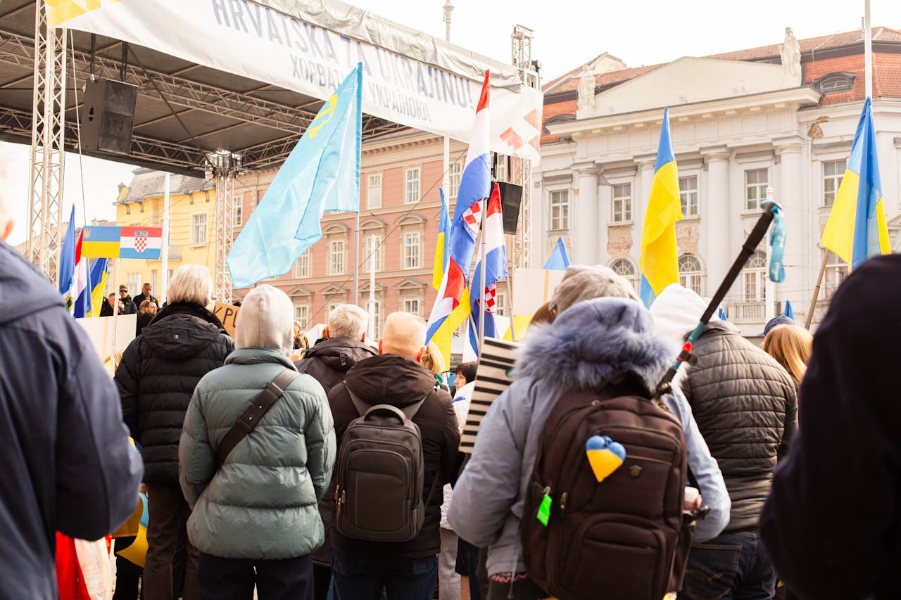 Crowds in Zagreb gather for a peaceful protest supporting Ukraine, showcasing unity and strength.